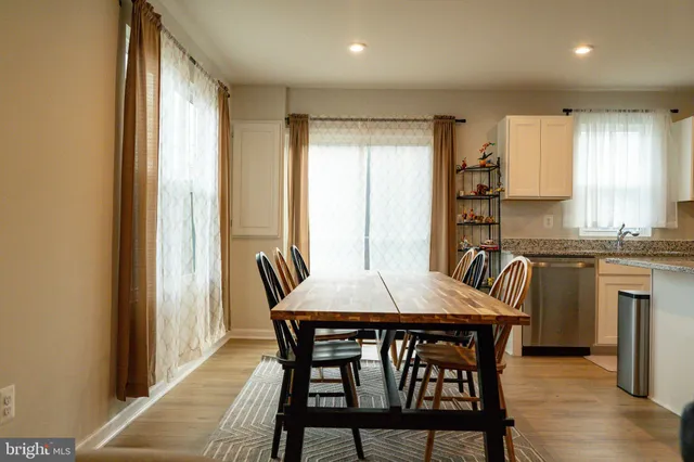 a view of a dining room with furniture and window