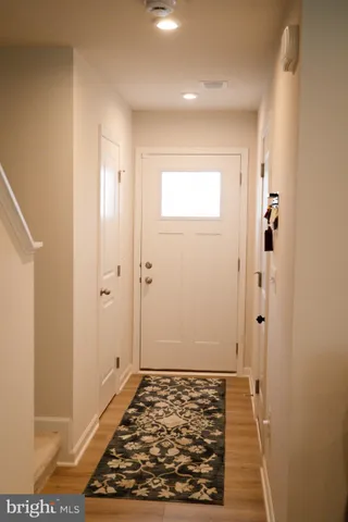 a view of a living room and kitchen with furniture and a view of living room