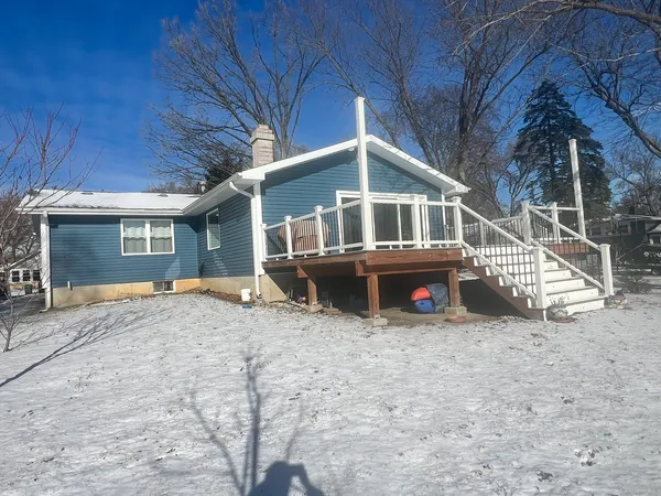 a view of a house with a yard and roof