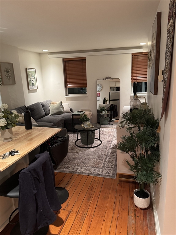 1914 Washington Street, Unit 4 Boston, MA 02118 - Photo 11 of 11 a living room with furniture and wooden floor