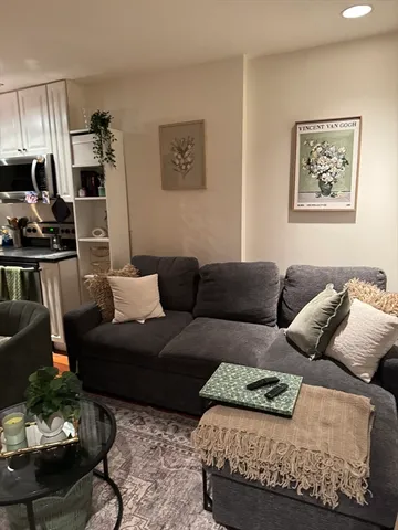 a living room with furniture and a couch