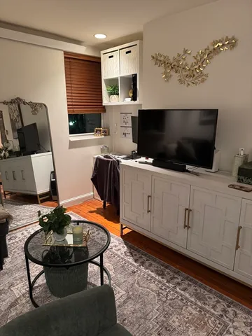 a room with furniture and a flat screen tv