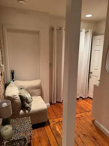 a bedroom with a bed and a mirror