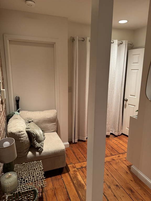 1914 Washington Street, Unit 4 Boston, MA 02118 - Photo 9 of 11 a bedroom with a bed and a mirror