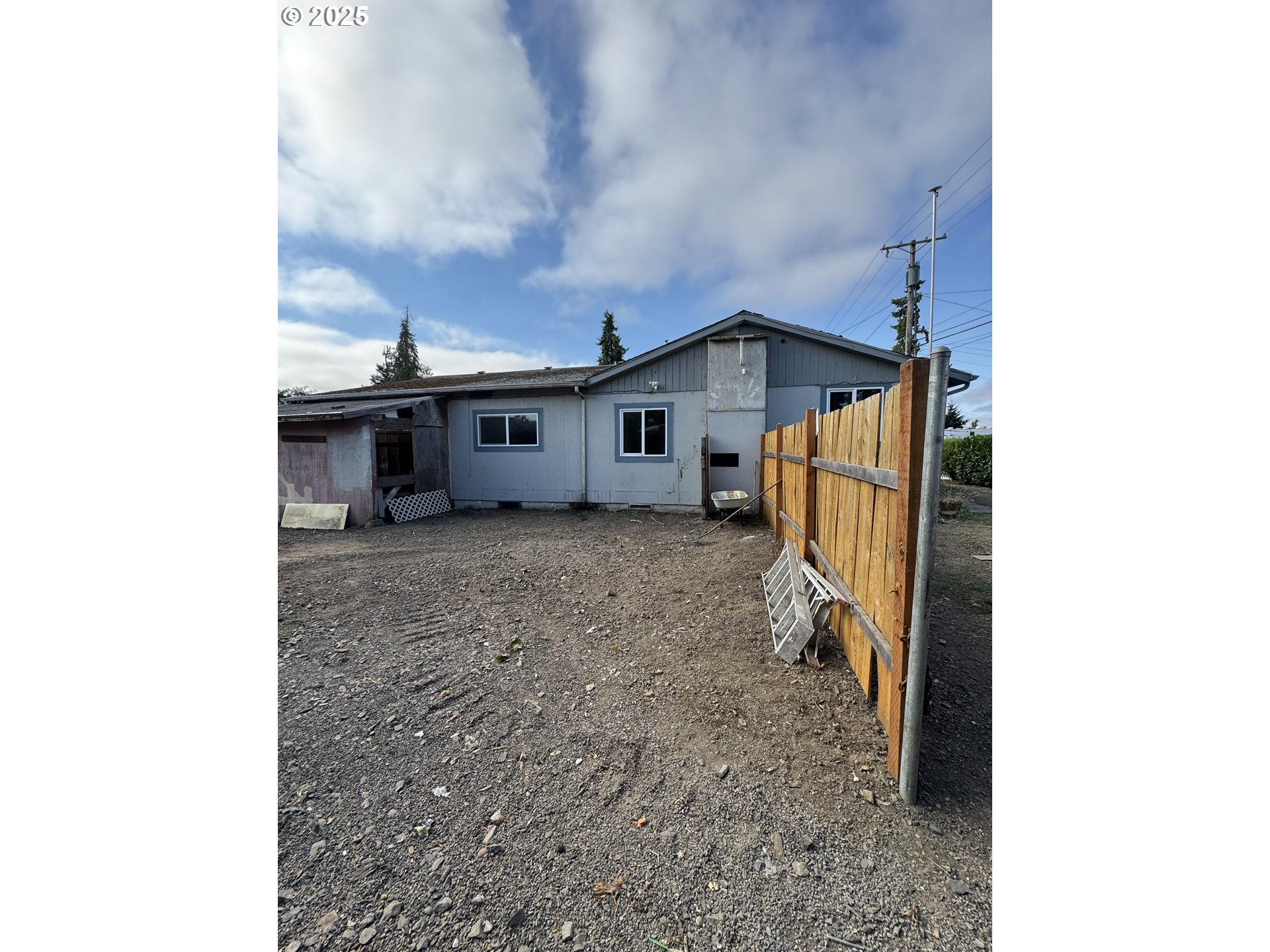 255 36th Street Springfield, OR 97478 - Photo 4 of 11 a view of a house with a backyard