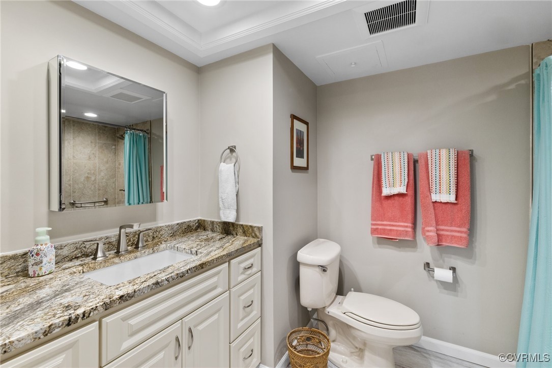 2956 Hathaway Road, Unit U912 Richmond, VA 23225 - Photo 12 of 29 a bathroom with a granite countertop toilet sink and mirror