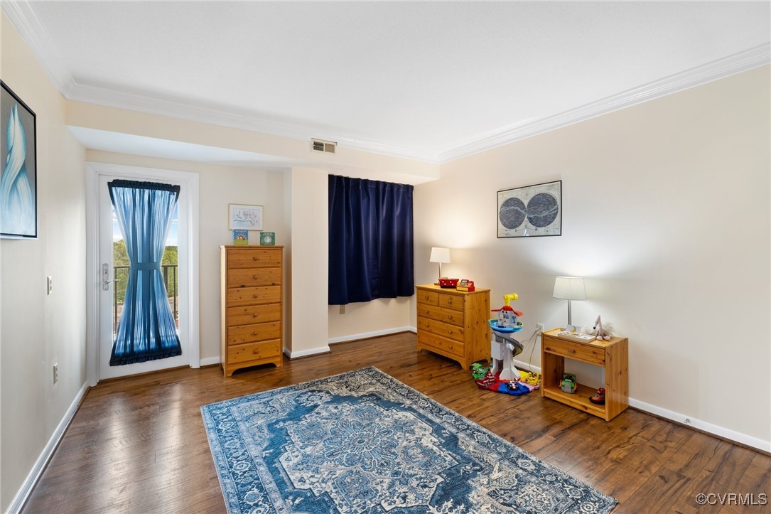 2956 Hathaway Road, Unit U912 Richmond, VA 23225 - Photo 14 of 29 a bedroom with furniture and wooden floor