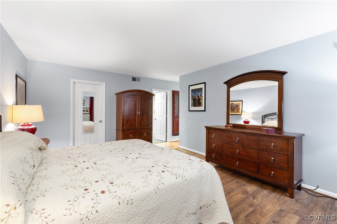 2956 Hathaway Road, Unit U912 Richmond, VA 23225 - Photo 18 of 29 a bedroom with a bed and a mirror on dresser