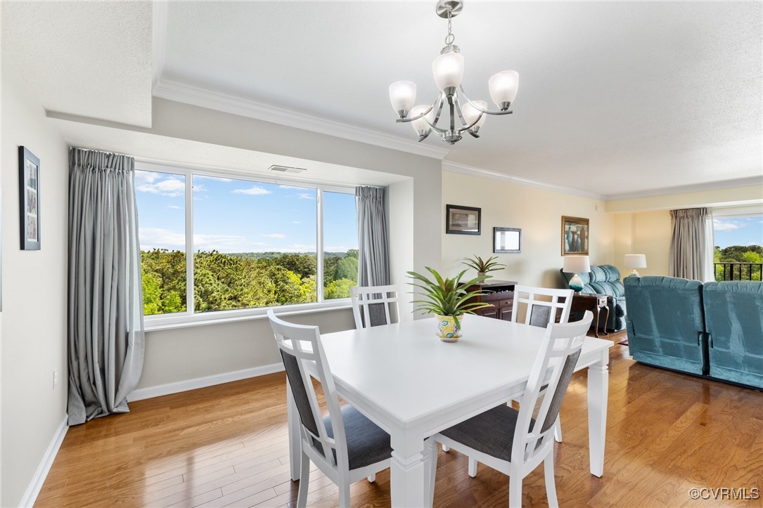 2956 Hathaway Road, Unit U912 Richmond, VA 23225 - Photo 8 of 29 a view of a dining room with furniture window and wooden floor