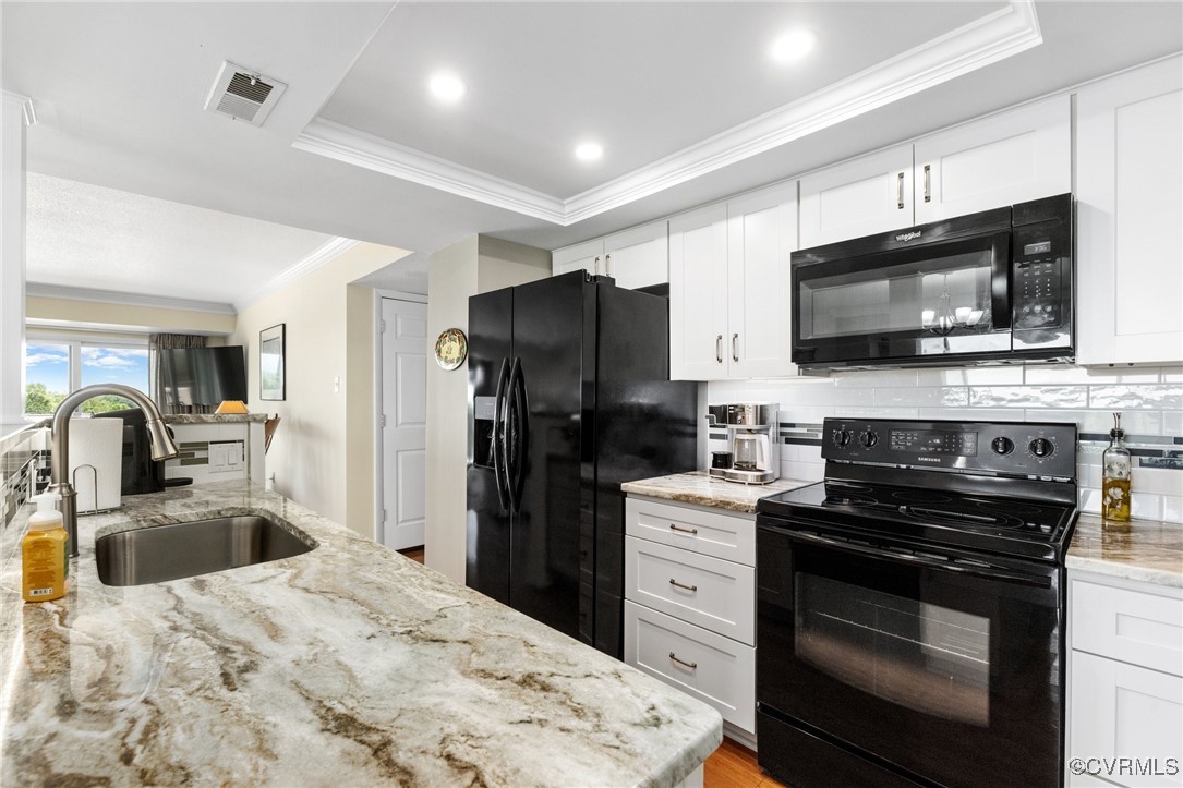 2956 Hathaway Road, Unit U912 Richmond, VA 23225 - Photo 9 of 29 a kitchen with a sink stove and refrigerator