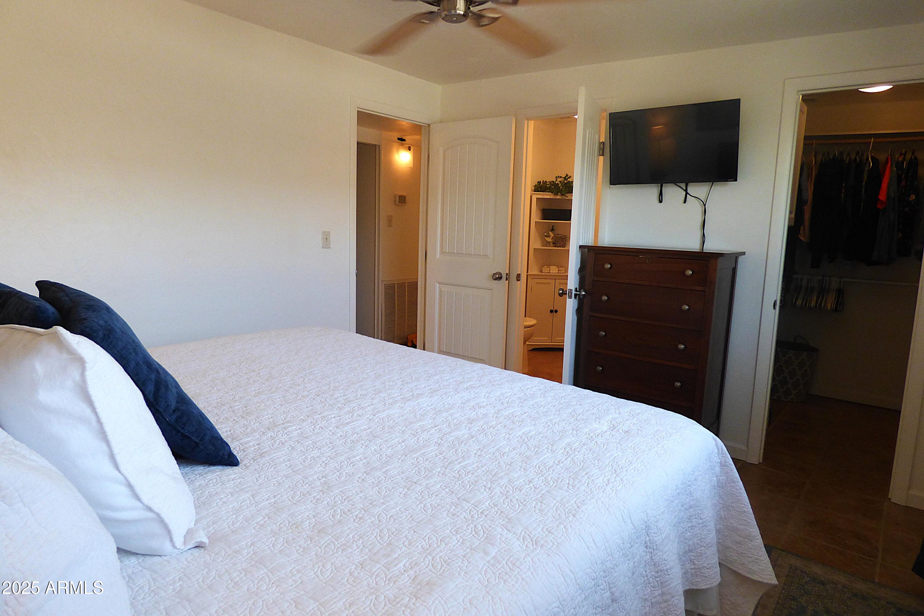 6700 East Thomas Road, Unit 34 Scottsdale, AZ 85251 - Photo 12 of 69 a bedroom with a bed and a flat screen tv
