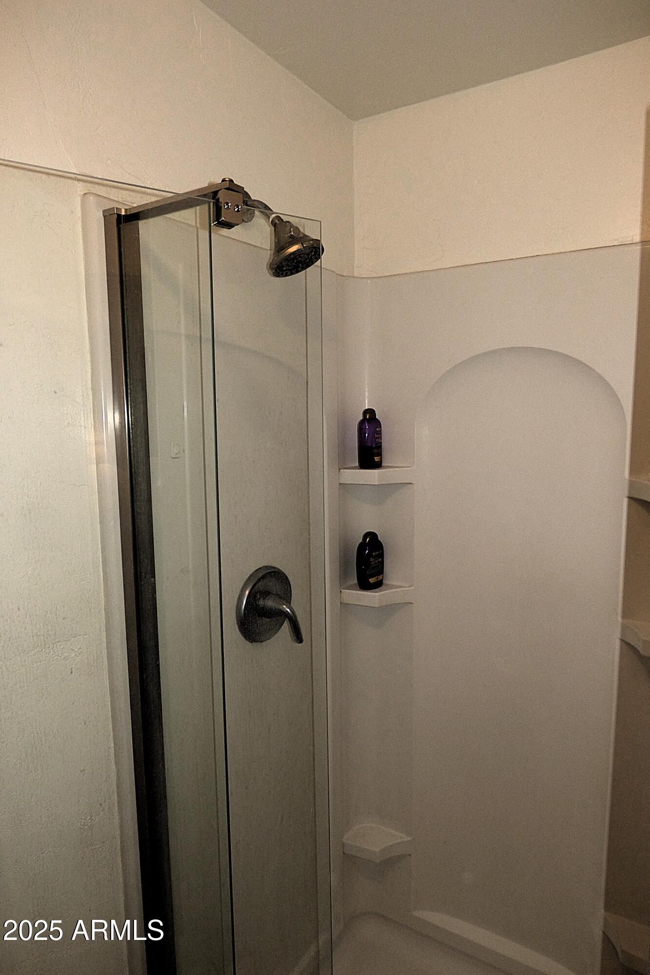 6700 East Thomas Road, Unit 34 Scottsdale, AZ 85251 - Photo 16 of 69 a bathroom with a shower and a mirror