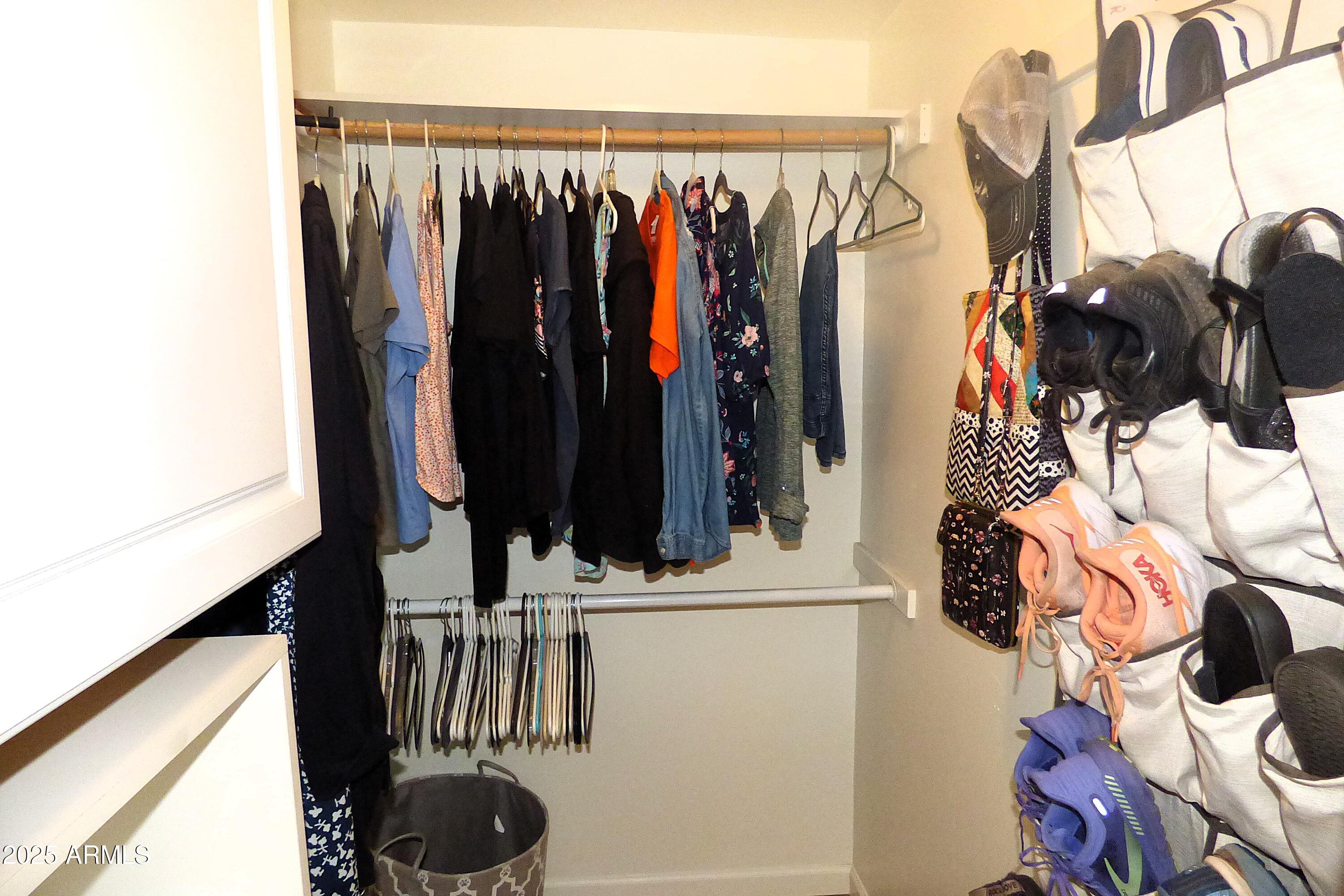 6700 East Thomas Road, Unit 34 Scottsdale, AZ 85251 - Photo 17 of 69 a view of walk in closet with clothes and shoes