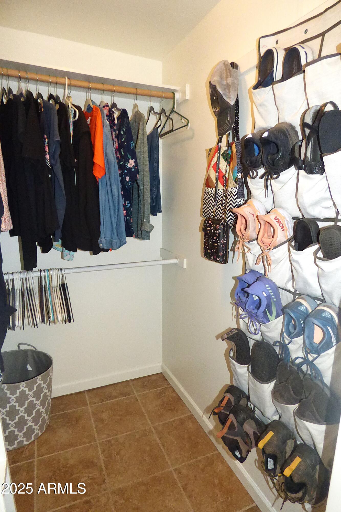 6700 East Thomas Road, Unit 34 Scottsdale, AZ 85251 - Photo 18 of 69 a view of walk in closet with clothes and shoes