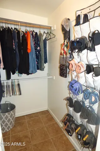 a view of a chairs and table in the back yard of the house