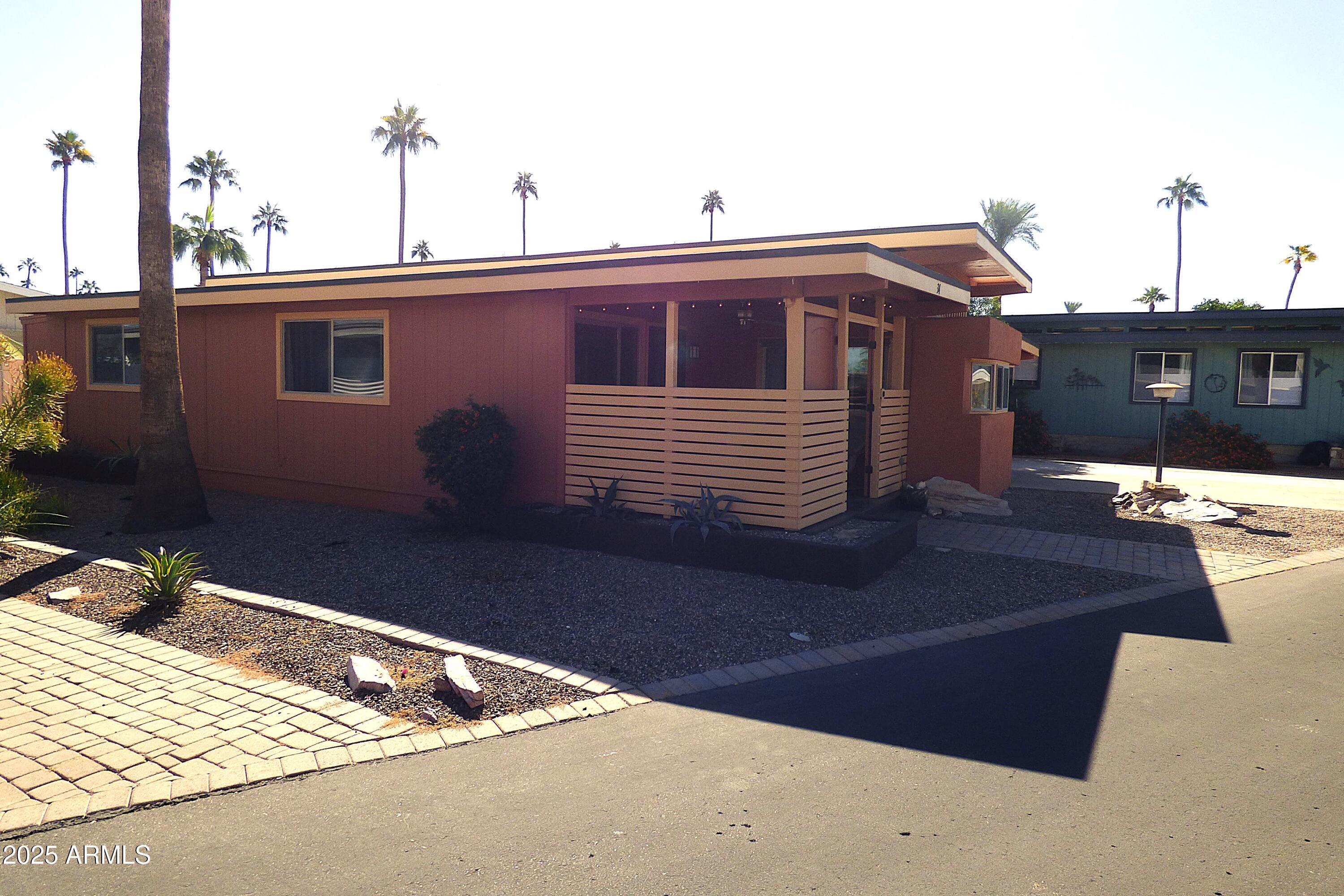 6700 East Thomas Road, Unit 34 Scottsdale, AZ 85251 - Photo 30 of 69 a front view of a house with a yard