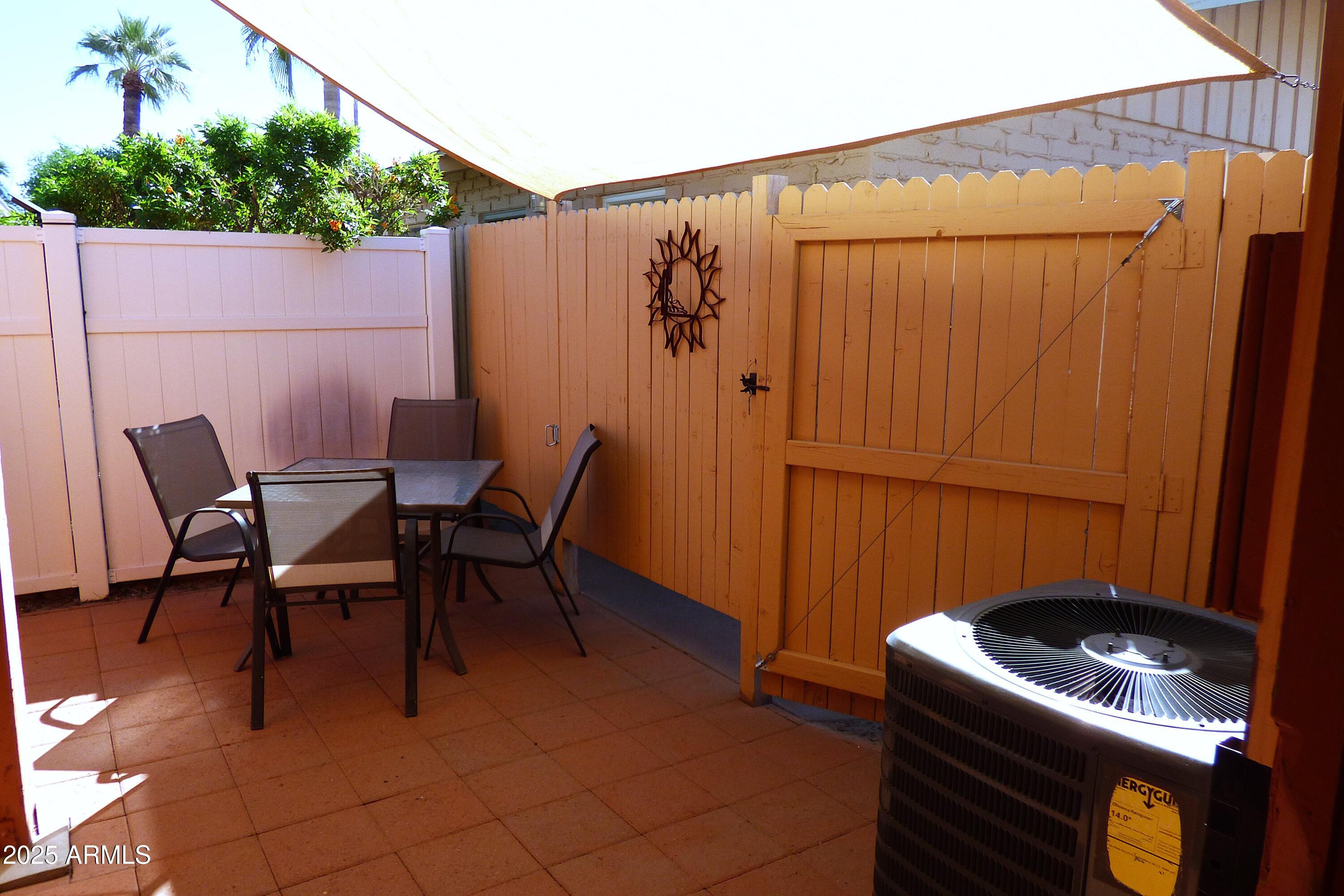6700 East Thomas Road, Unit 34 Scottsdale, AZ 85251 - Photo 36 of 69 a view of a chairs and table in the back yard of the house
