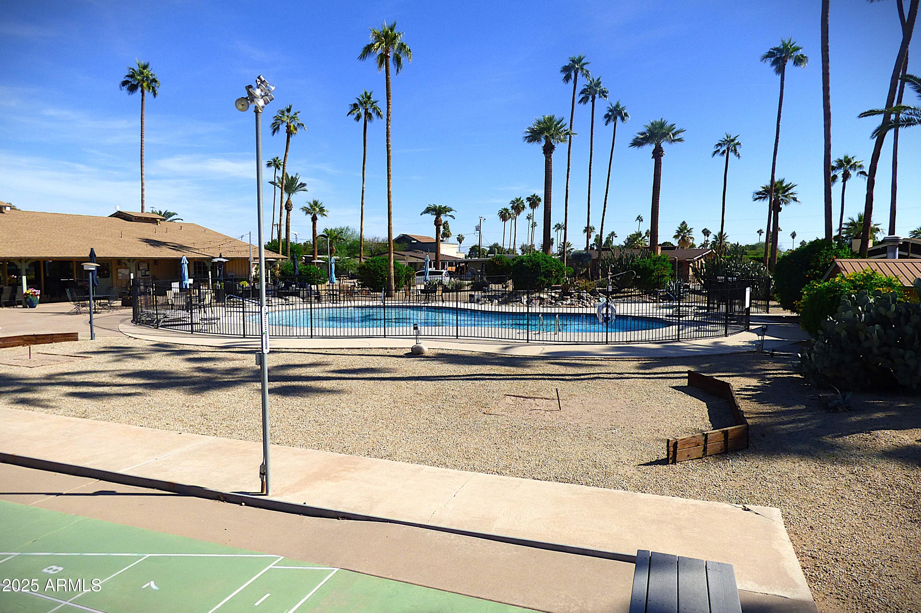 6700 East Thomas Road, Unit 34 Scottsdale, AZ 85251 - Photo 43 of 69 a view of a swimming pool with a patio