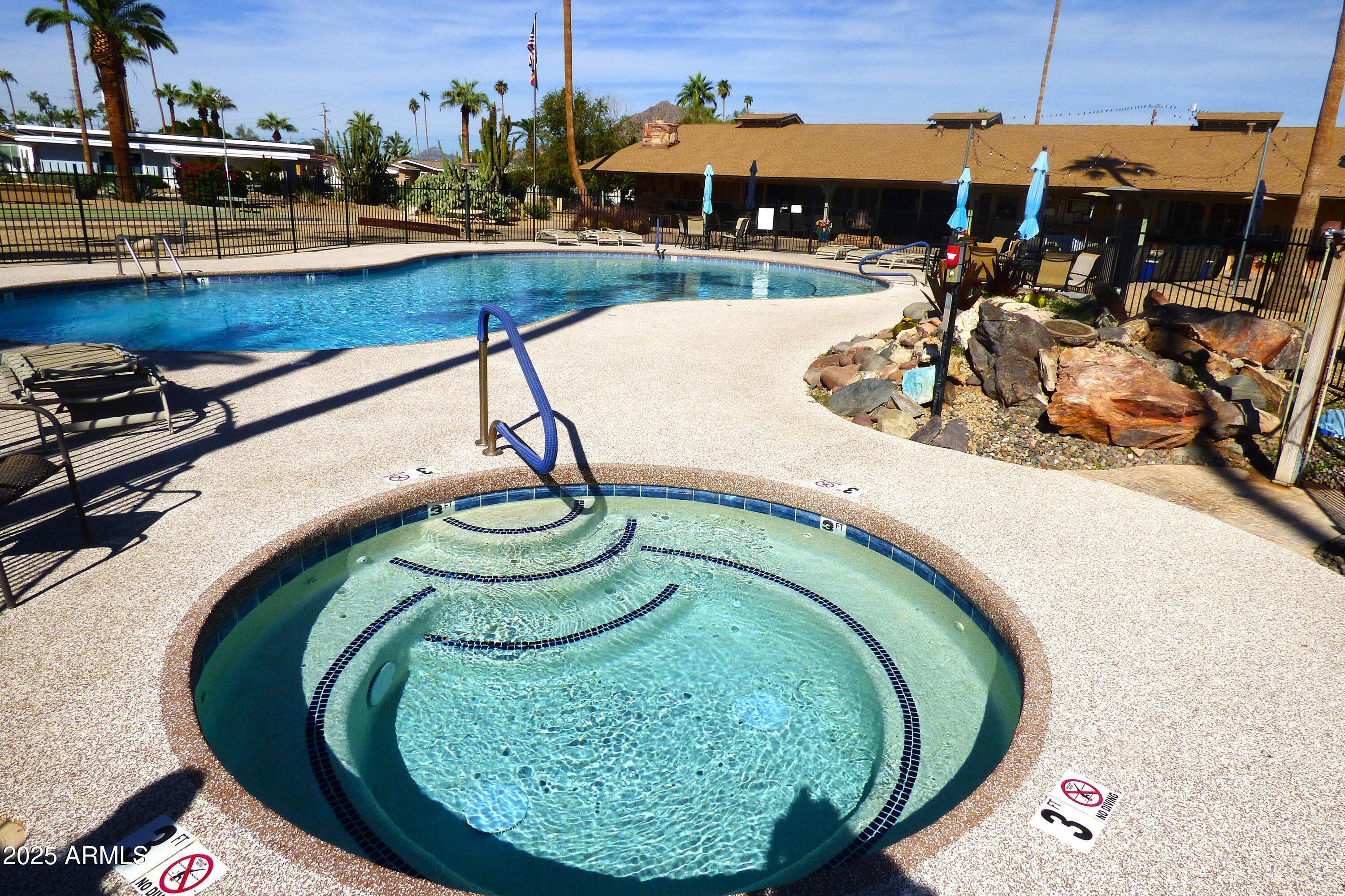 6700 East Thomas Road, Unit 34 Scottsdale, AZ 85251 - Photo 47 of 69 a swimming pool with outdoor seating and outdoor seating