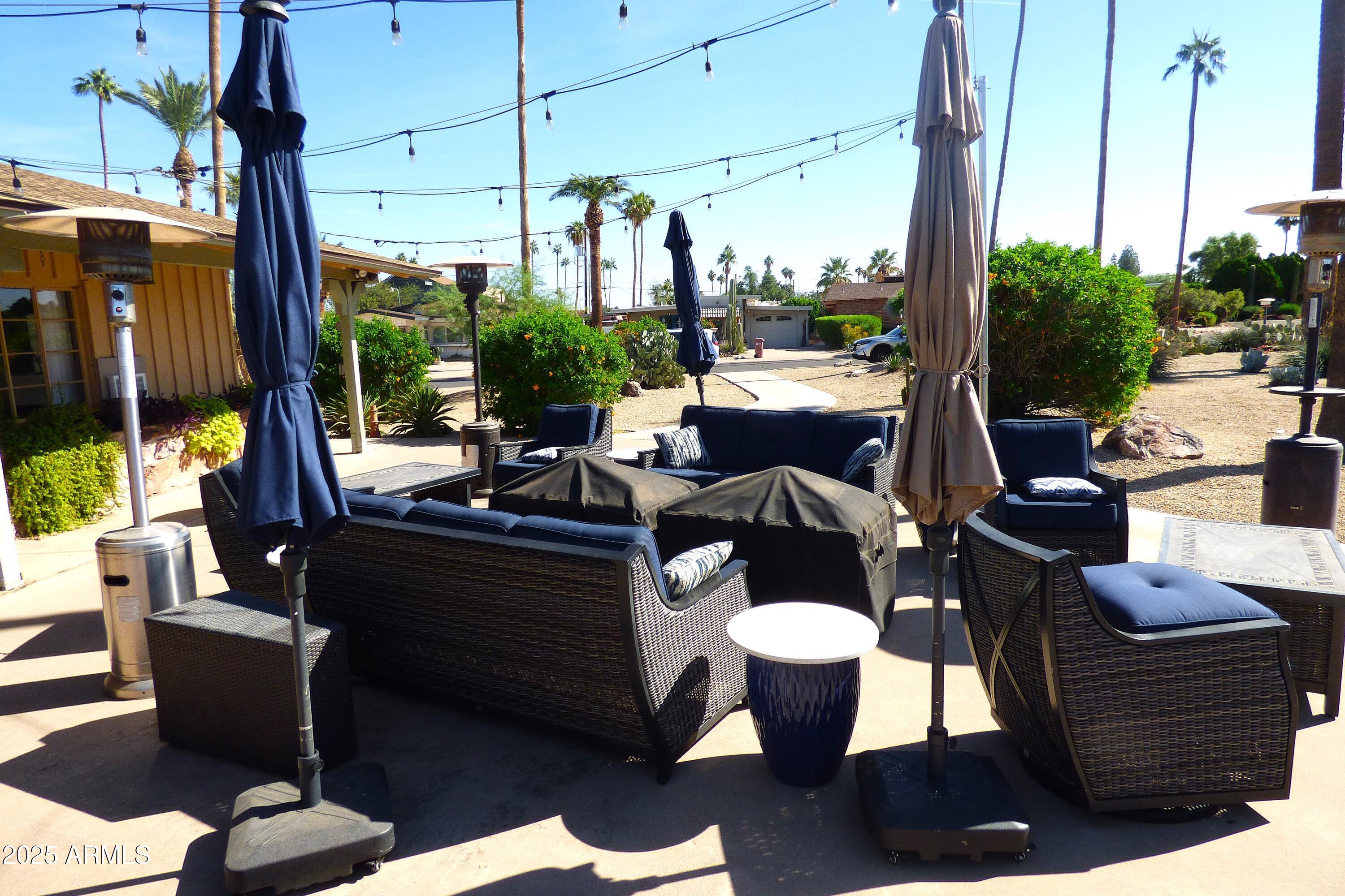 6700 East Thomas Road, Unit 34 Scottsdale, AZ 85251 - Photo 53 of 71 a view of a living room with furniture and a floor to ceiling window