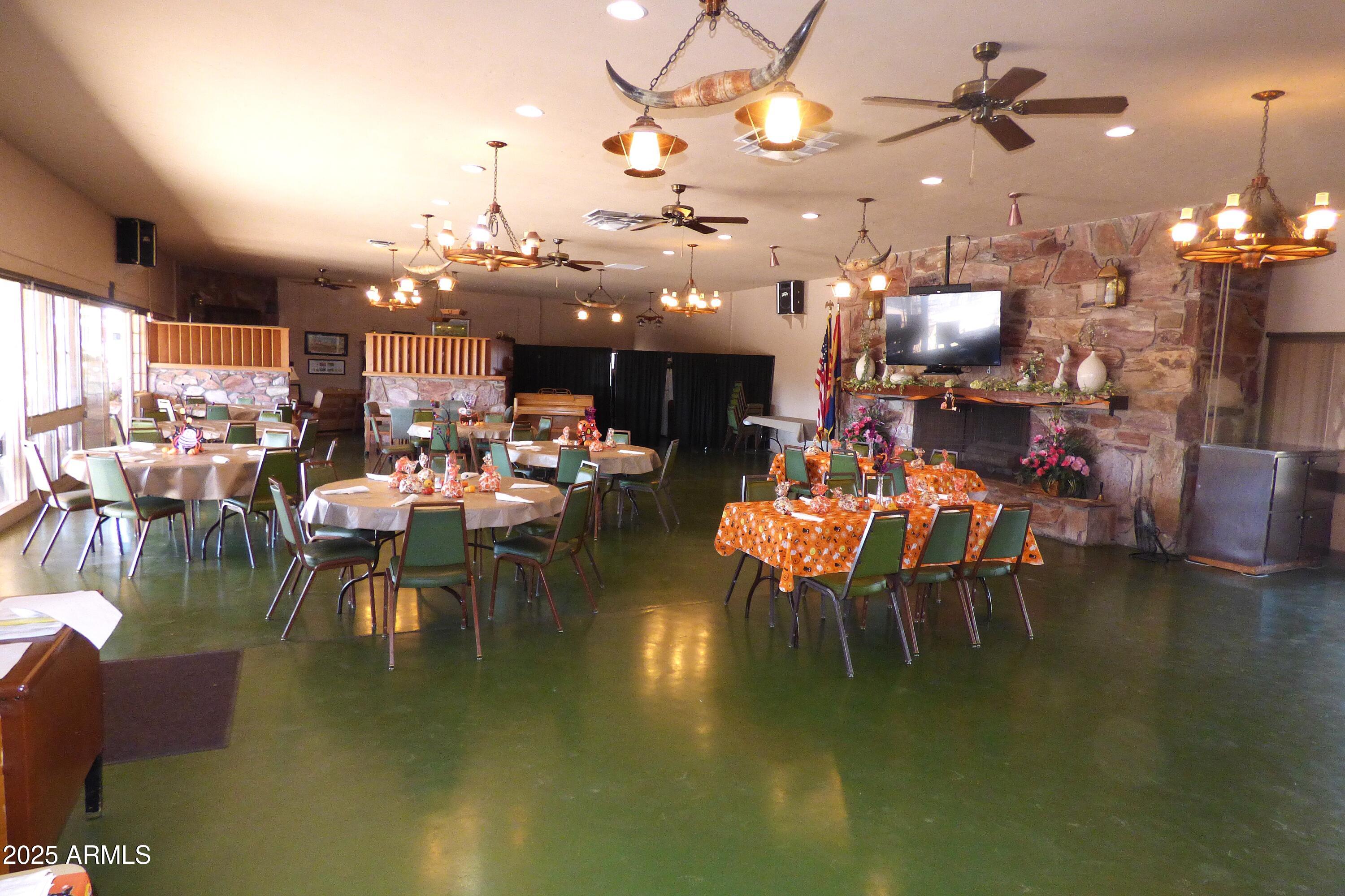 6700 East Thomas Road, Unit 34 Scottsdale, AZ 85251 - Photo 56 of 71 a living room with lots of furniture and a chandelier