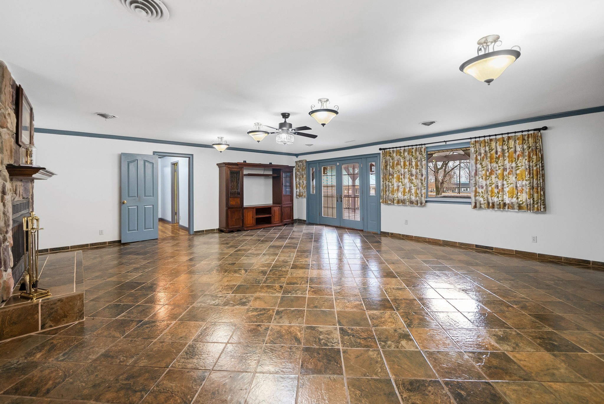 369 Holiday Acres Drive Springville, TN 38256 - Photo 11 of 100 a view of an empty room with a window and wooden floor