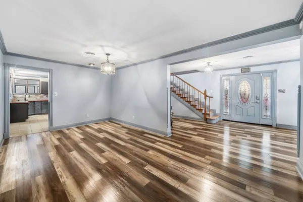 a kitchen with stainless steel appliances granite countertop a stove a sink and a refrigerator