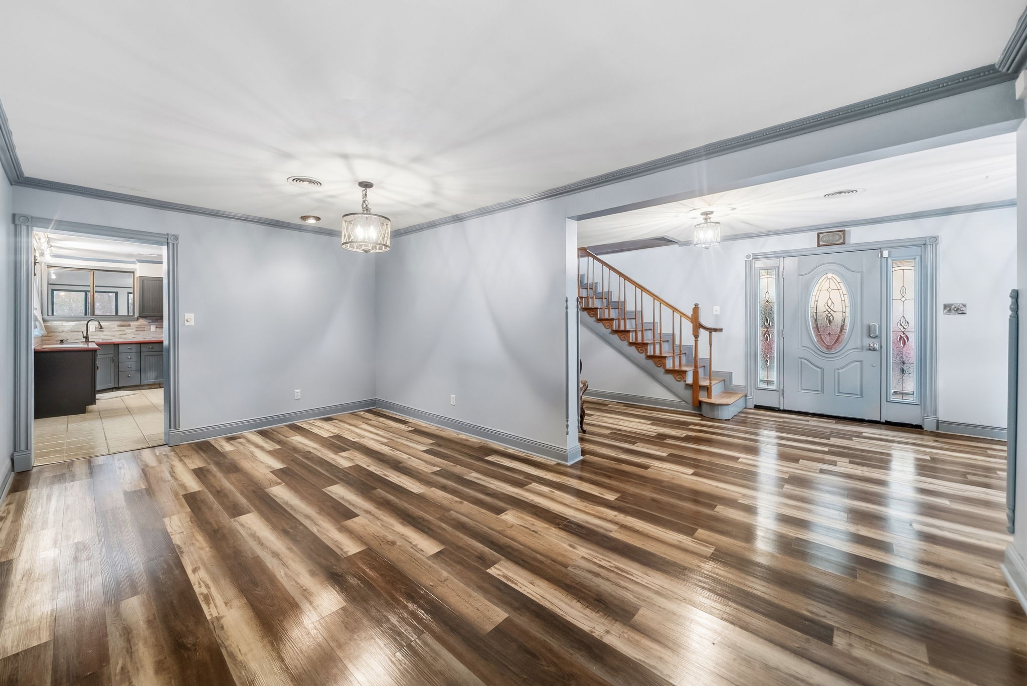 369 Holiday Acres Drive Springville, TN 38256 - Photo 15 of 100 a view of a livingroom with wooden floor and stairs