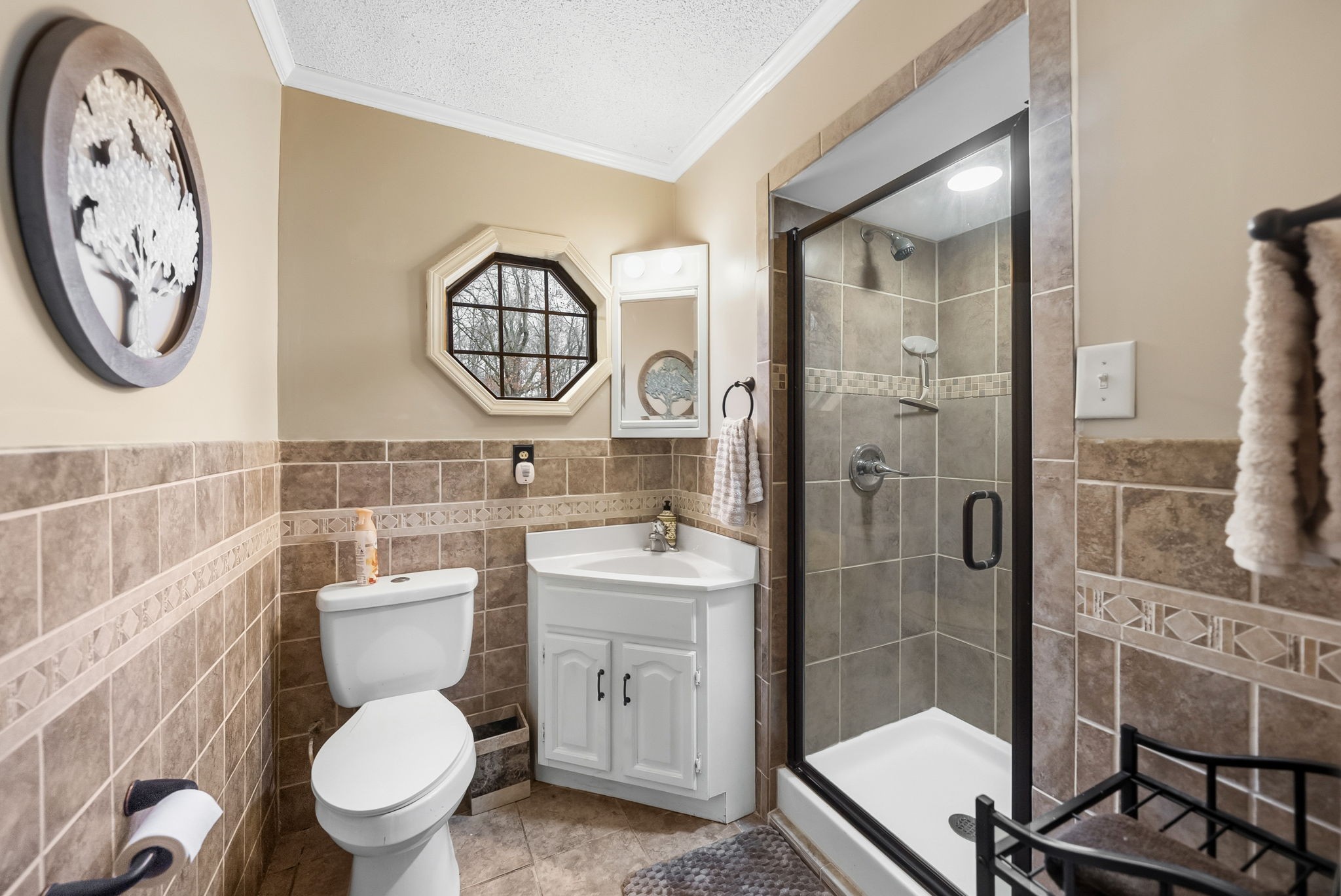 369 Holiday Acres Drive Springville, TN 38256 - Photo 19 of 100 a bathroom with a toilet a sink and a shower