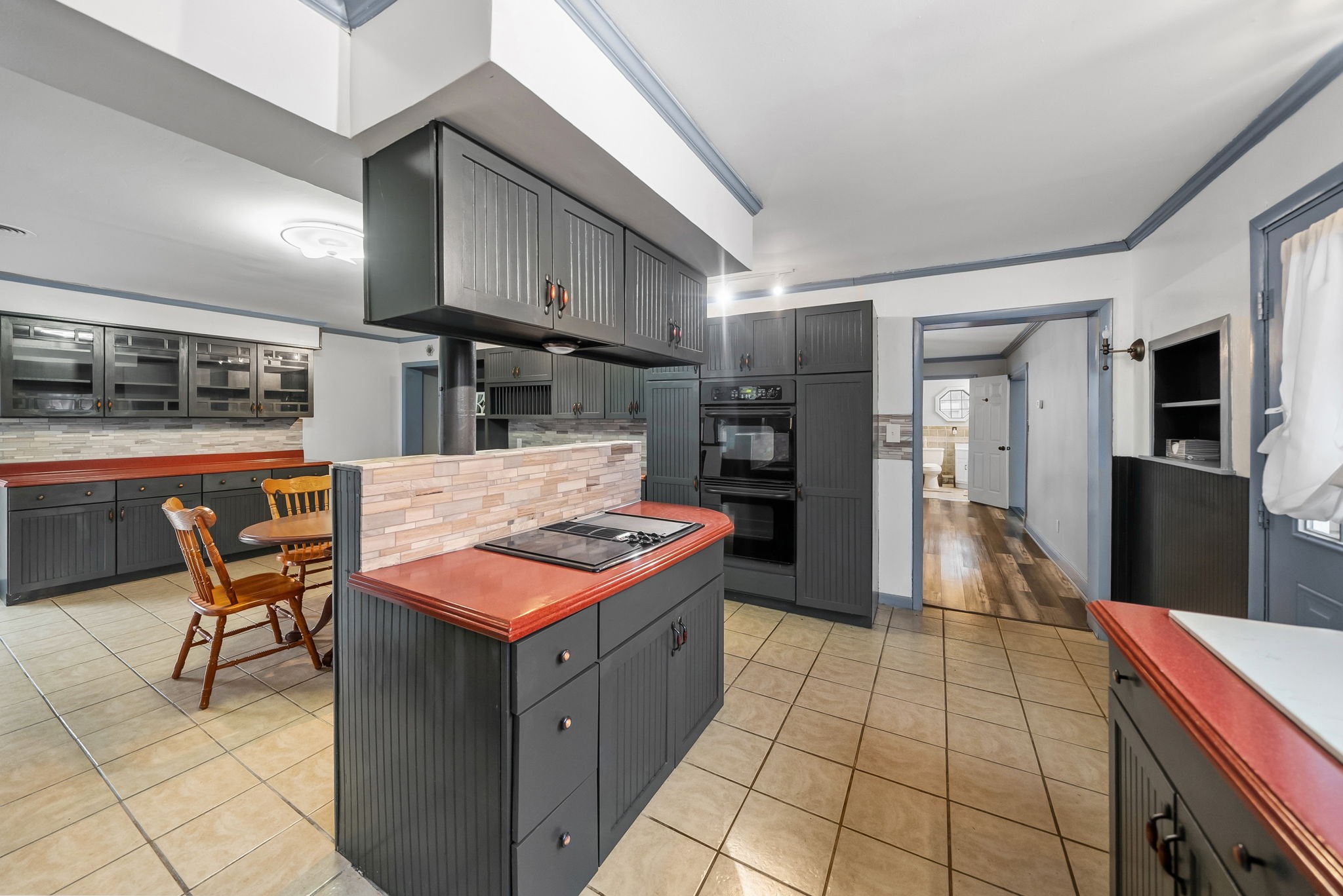 369 Holiday Acres Drive Springville, TN 38256 - Photo 22 of 100 a kitchen with stainless steel appliances granite countertop a stove a sink and a refrigerator