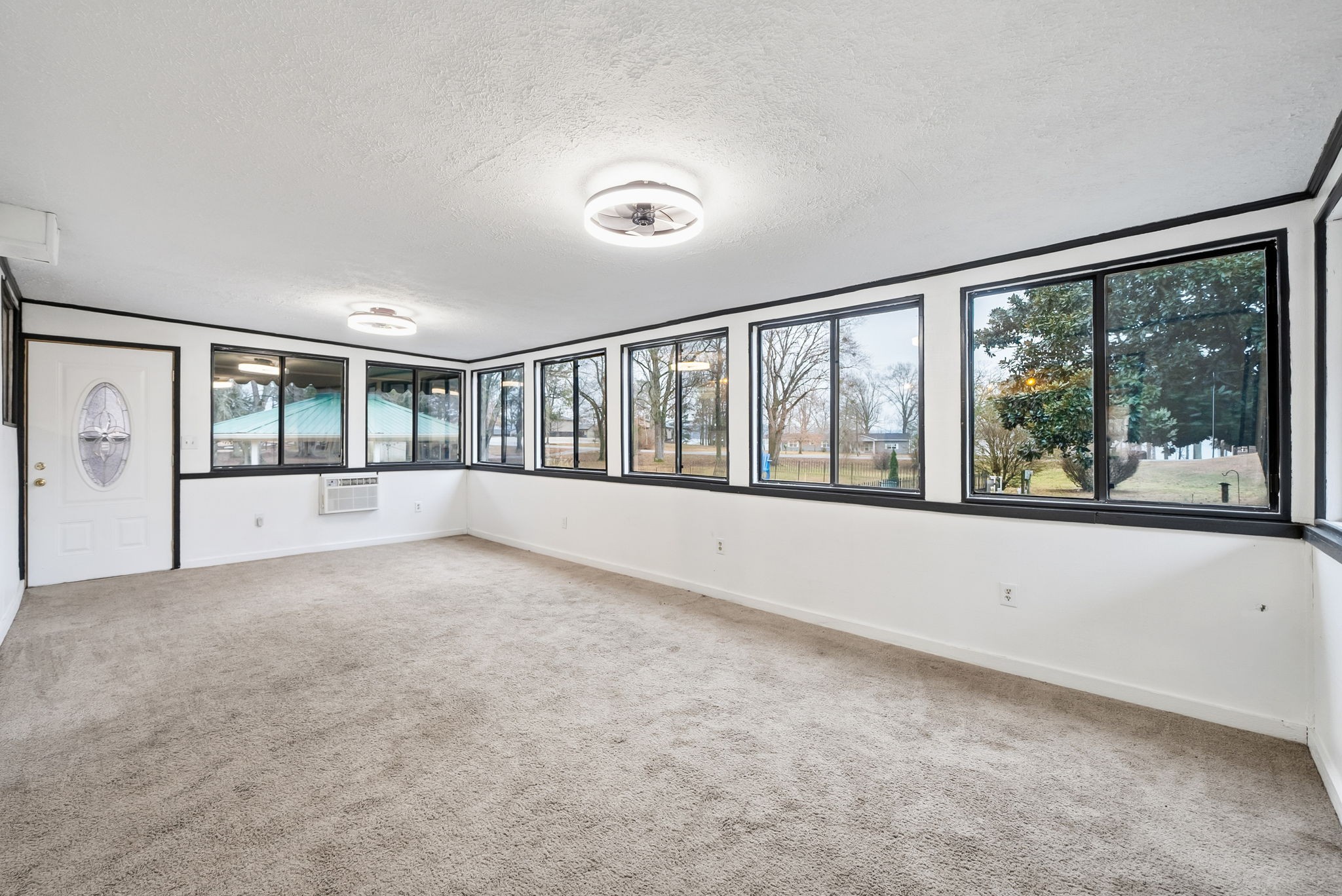 369 Holiday Acres Drive Springville, TN 38256 - Photo 27 of 100 wooden floor in an empty room with a large window