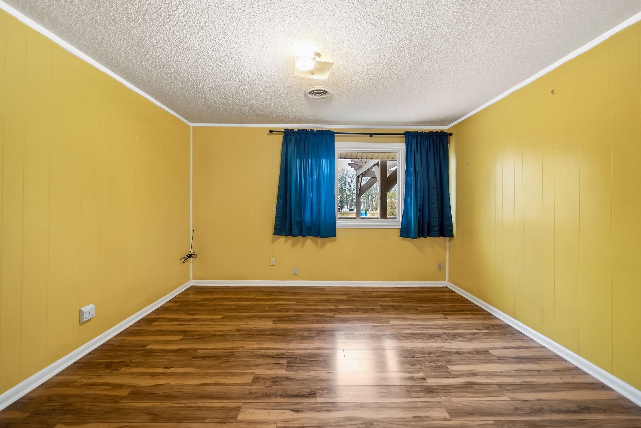 369 Holiday Acres Drive Springville, TN 38256 - Photo 37 of 100 a view of an empty room with wooden floor