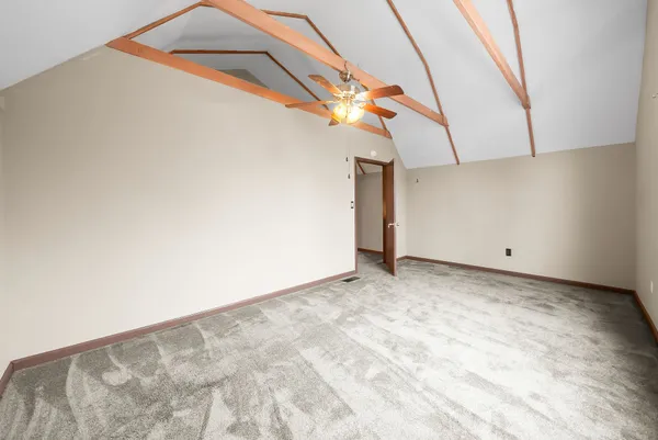 a view of a balcony with wooden floor