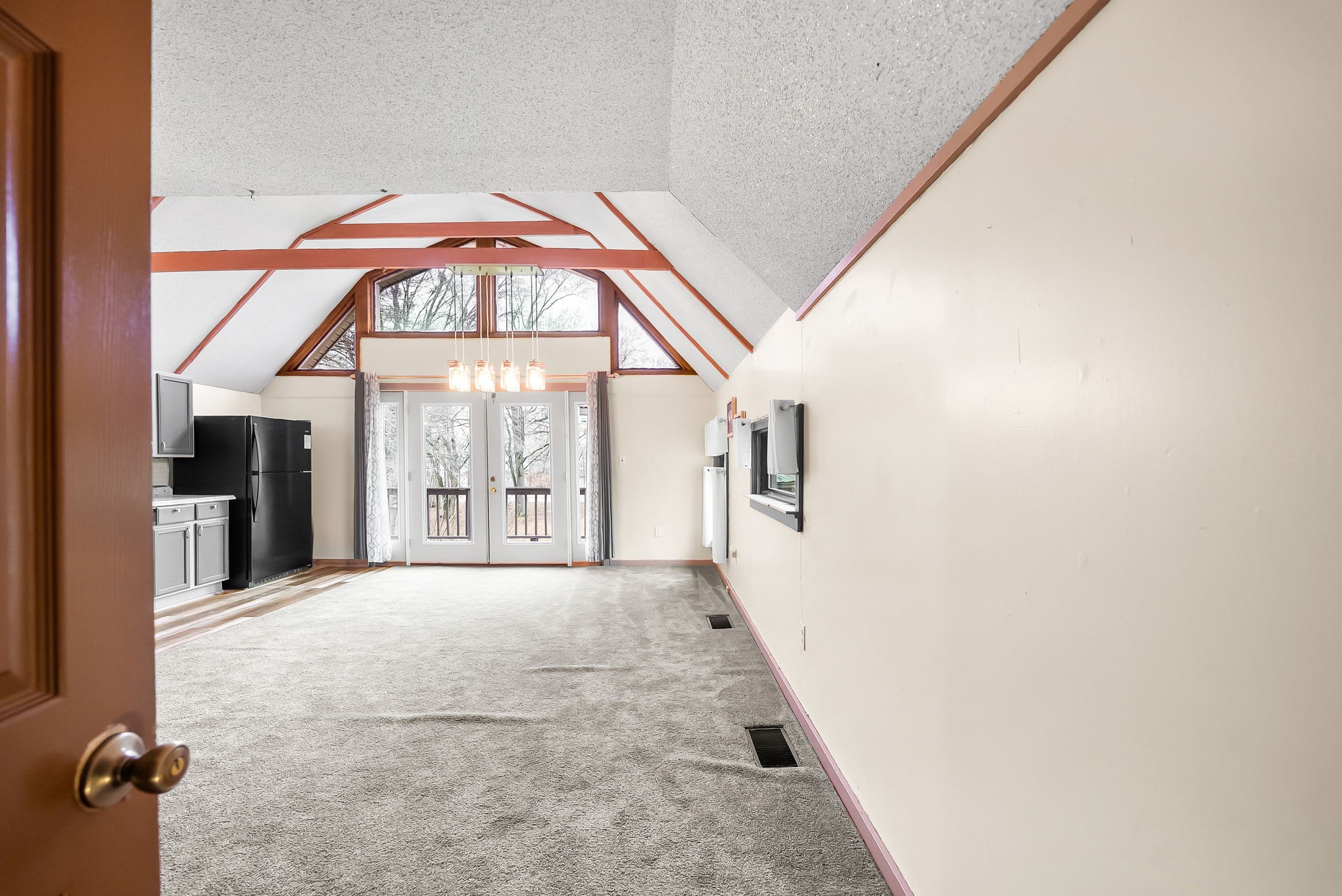 369 Holiday Acres Drive Springville, TN 38256 - Photo 48 of 100 an empty room with a fireplace and windows