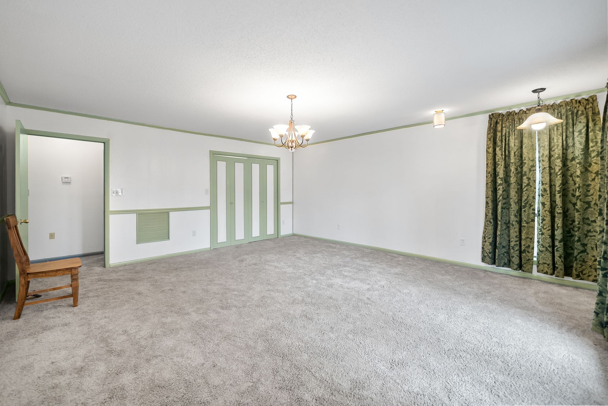 369 Holiday Acres Drive Springville, TN 38256 - Photo 56 of 100 an empty room with chandelier fan and windows