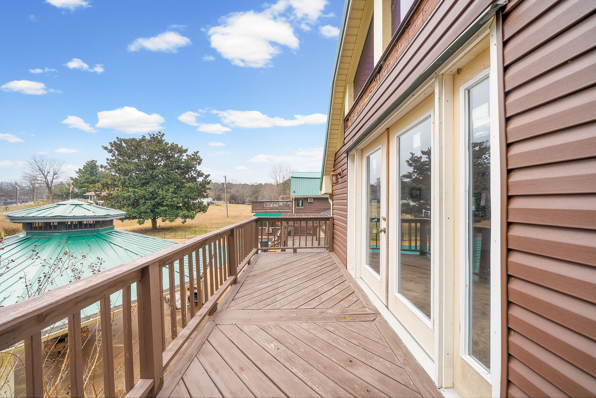 369 Holiday Acres Drive Springville, TN 38256 - Photo 78 of 100 a view of a balcony with wooden floor