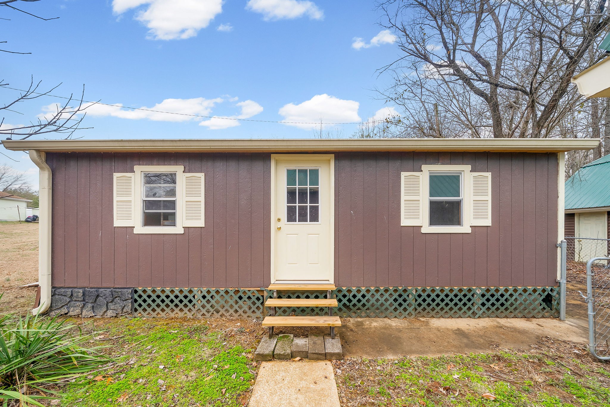 369 Holiday Acres Drive Springville, TN 38256 - Photo 83 of 100 a front view of a house with a yard