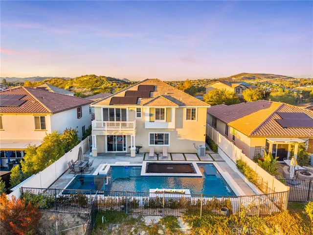 an aerial view of a house with swimming pool