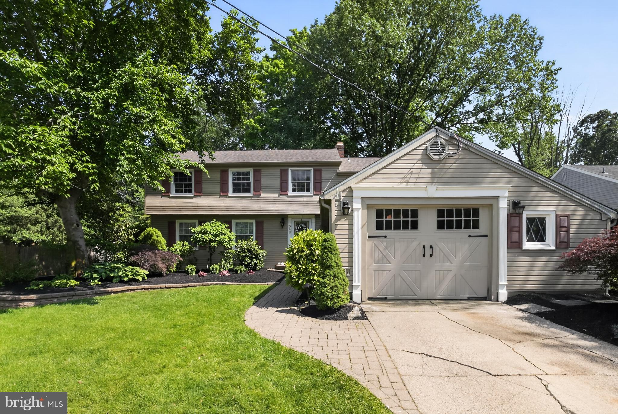 549 Covered Bridge Road Cherry Hill, NJ 08034 - Photo 16 of 16 a front view of a house with a garden
