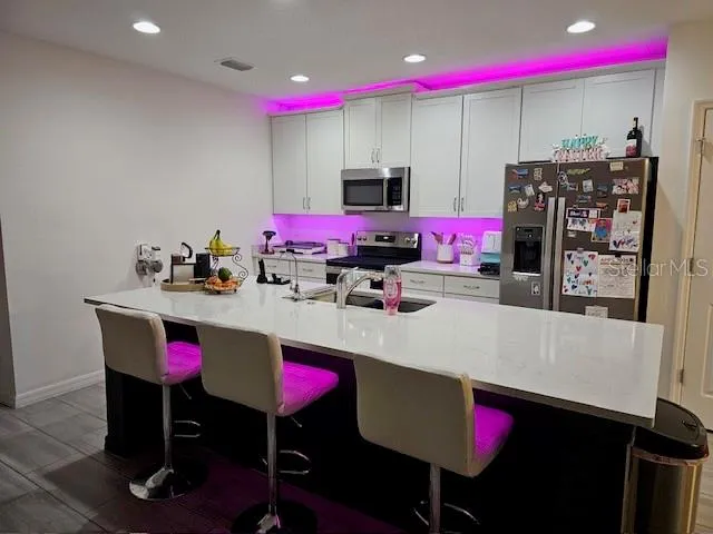 a room with musical instruments and air hockey table