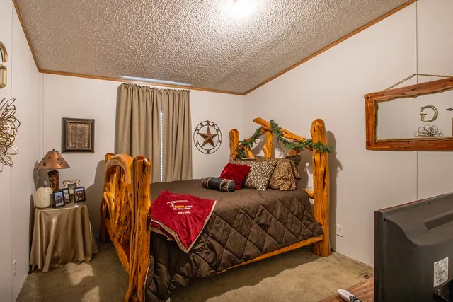 a bed room with a bed and a window