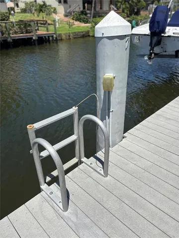 a view of a chair and table in the backyard