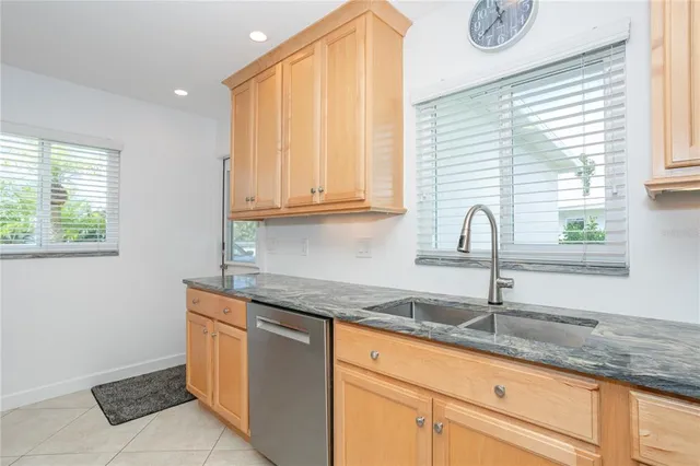 a bedroom with a bed and a flat screen tv in a dresser