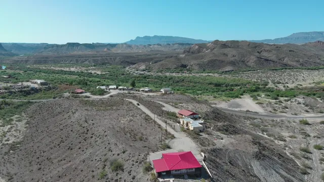 a view of a forest with mountain and trees