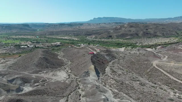 a view of a dry yard with mountain