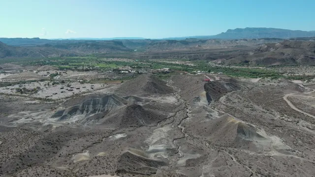 a view of a dry yard with mountain
