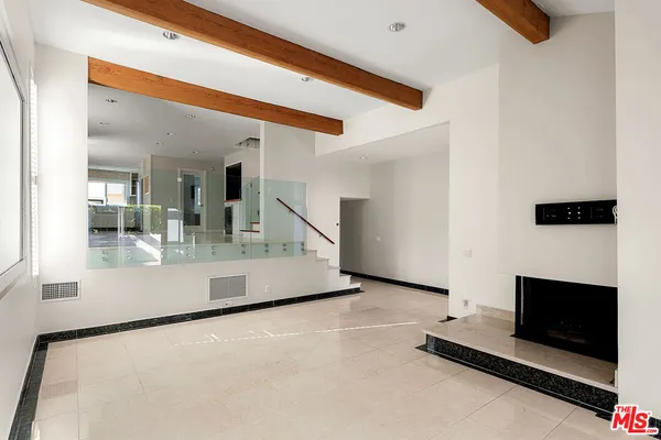a view of kitchen with furniture and fireplace