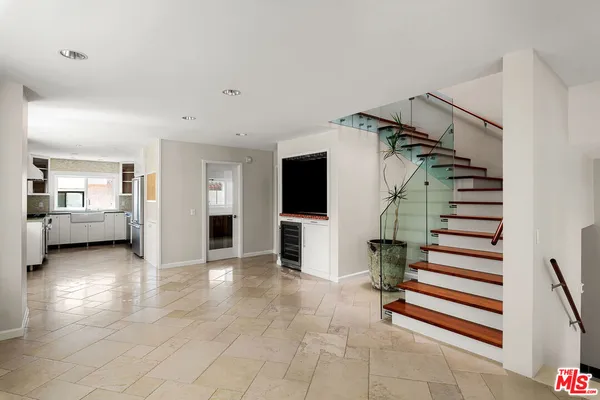 a view of a livingroom with a staircase