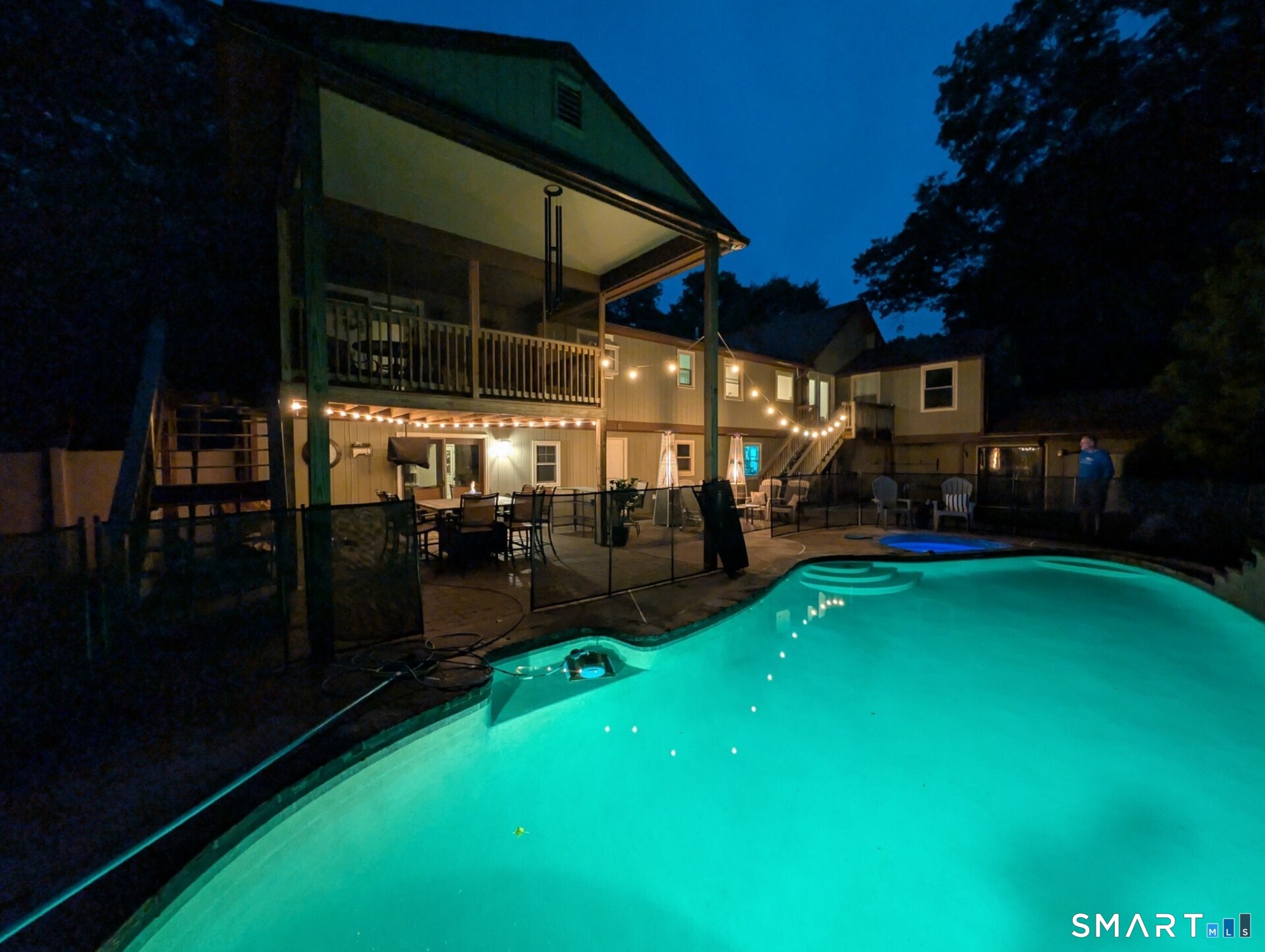 122 Ridgeview Circle Guilford, CT 06437 - Photo 32 of 40 Owner photo showcasing the pool beautifully lit at night, creating a simply lovely ambiance.