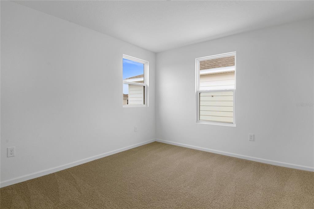 236 Flag Lilly Lane Umatilla, FL 32784 - Photo 12 of 25 an empty room with a window